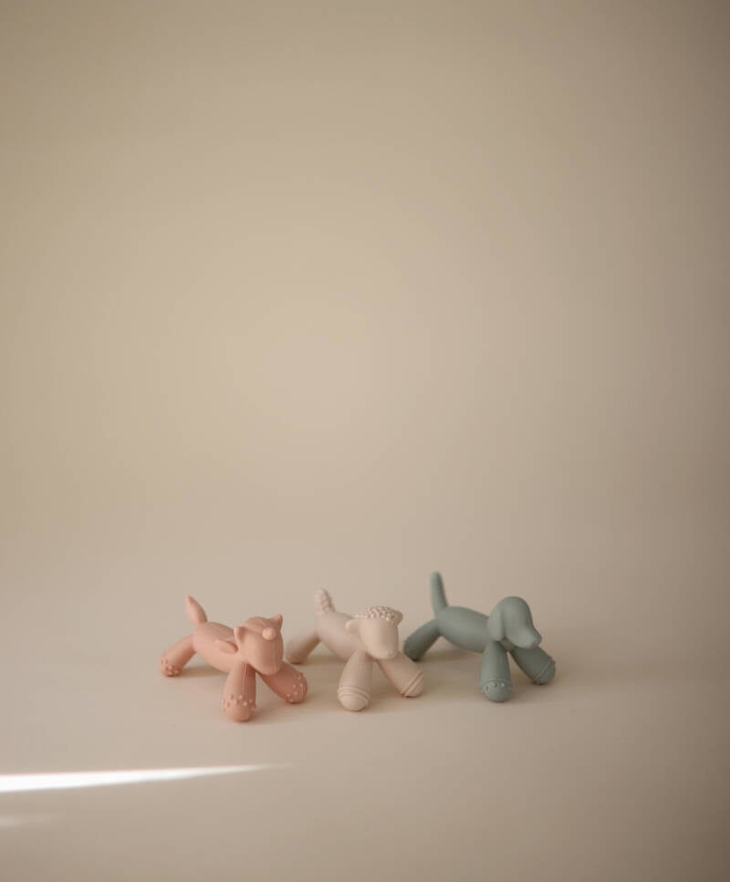 Eenhoorn-bijtfiguren in roze, crème en blauw